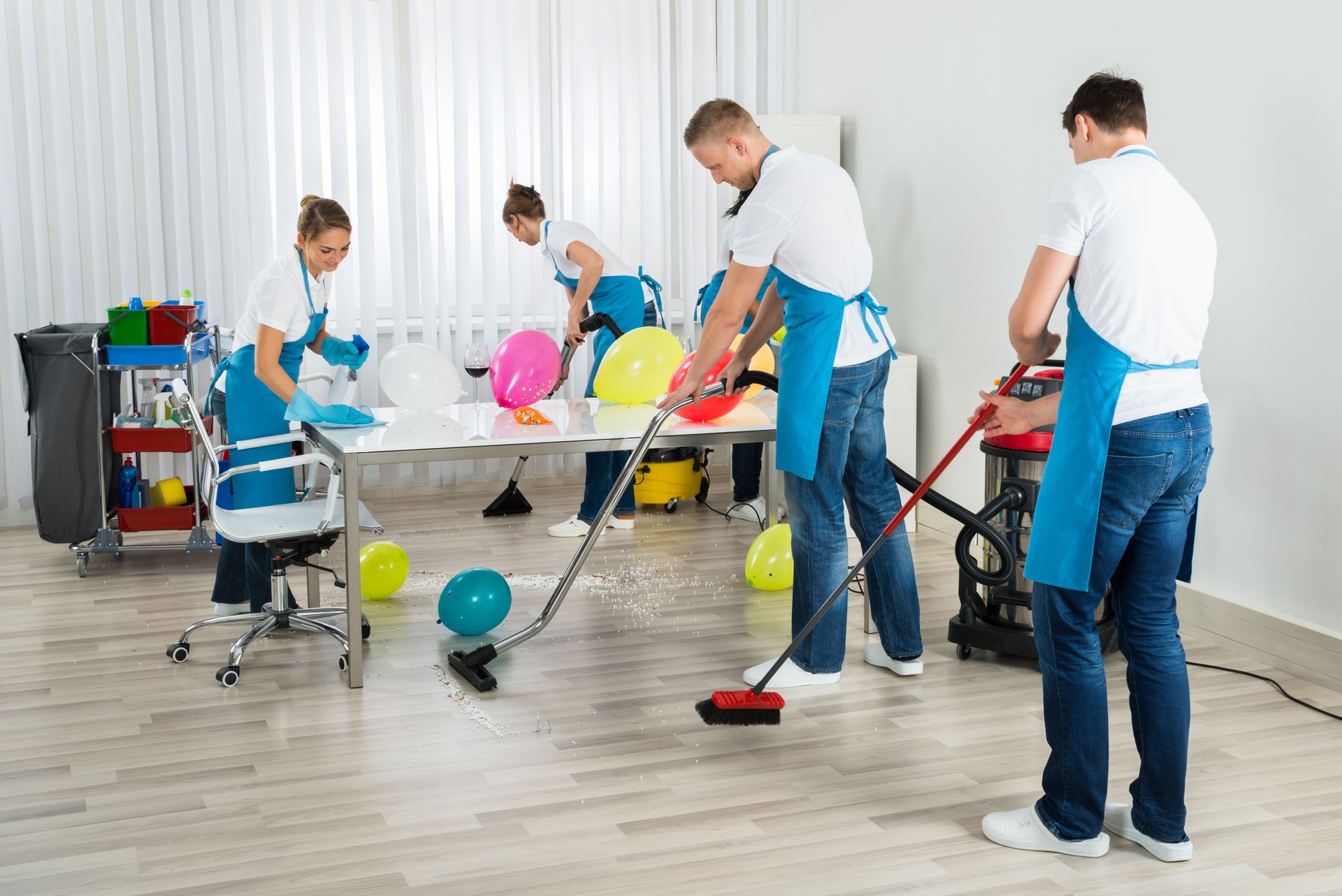 Janitors Cleaning The Office After Party